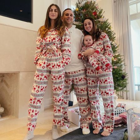 Meegan's ex-husband, Micheal Rubin, his daughter, and his new wife took a family picture in their PJs on Christmas.